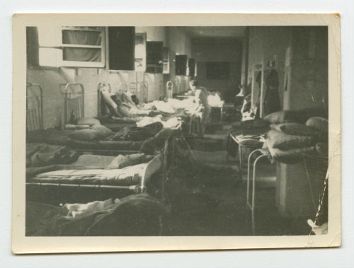 Evacuating the last ward in Tobruk Hospital. Recto