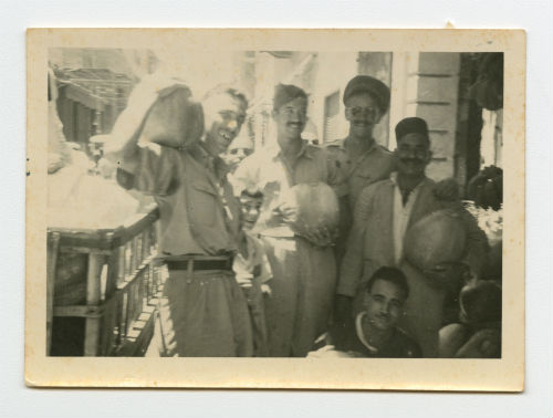 John Nettleton, Bill Carter and Torleif "Tor" Torland making a purchase in Alexandria, Egypt. Recto