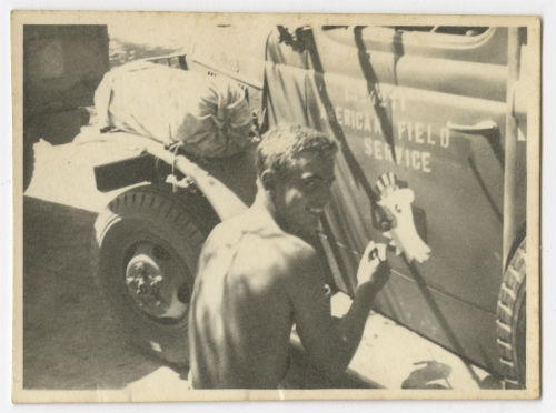 Richard "Dick" Edwards prints a "chicken" (567 Coy Insignia) on an AFS ambulance. Recto