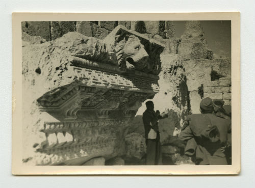 Baalbek, Lebanon (guide beneath a fallen fragment from the Temple of Jupiter). Photograph Recto