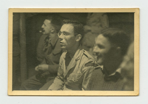 Dave Hyatt, Arthur Howe Jr. and Captain Feltham listening to a lecture. Recto