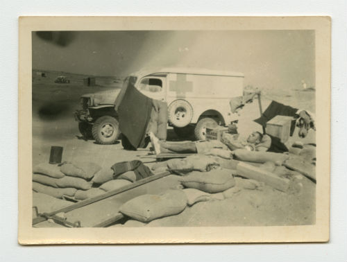 Arthur Howe, Jr. relaxing on the dugout at Tobruk, Libya. Recto