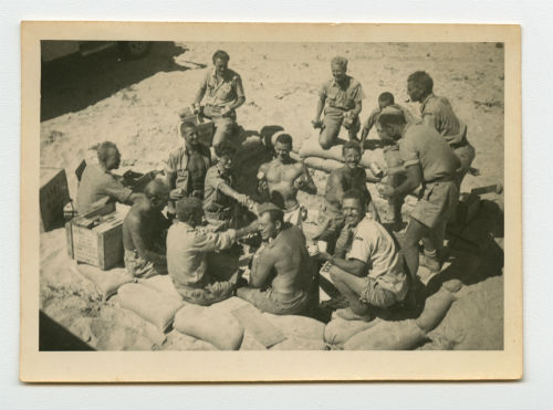 Distributing the spoils of war during the retreat from Tobruk, Libya. Recto