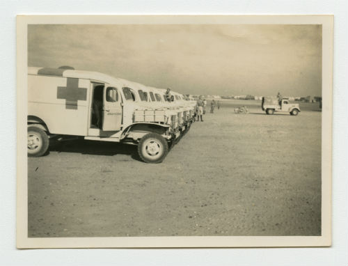 AFS ambulances lined up for inspection at the El Tahag Mobilization Camp. Recto
