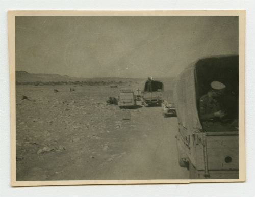 Ambulance convoy in the desert. Recto