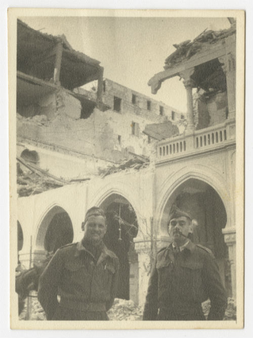 Charles "Charlie" Snead and "Webby" in the bombed town of Sousse, Tunisia. Recto