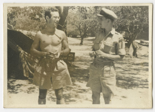 Arthur Howe, Jr. in front of his tent with Charles Beach Powell near Tripoli, Libya. Recto