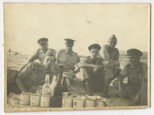 AFS volunteers having a picnic on the beach in Tripoli, Libya with lime juice and local wine. Recto1