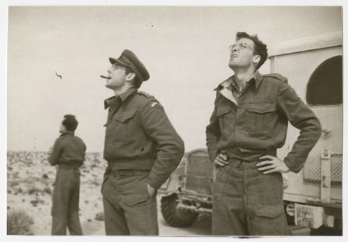 Arthur Howe, Jr. and Kirk LeMoyne "Lem" Billings watching a dogfight overhead in Tunisia. Recto